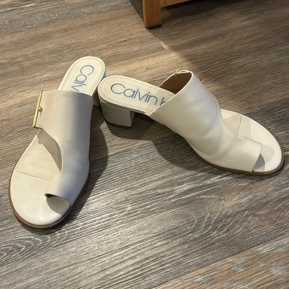 Beige, low heel slides, sized 9.5. Gold hardware